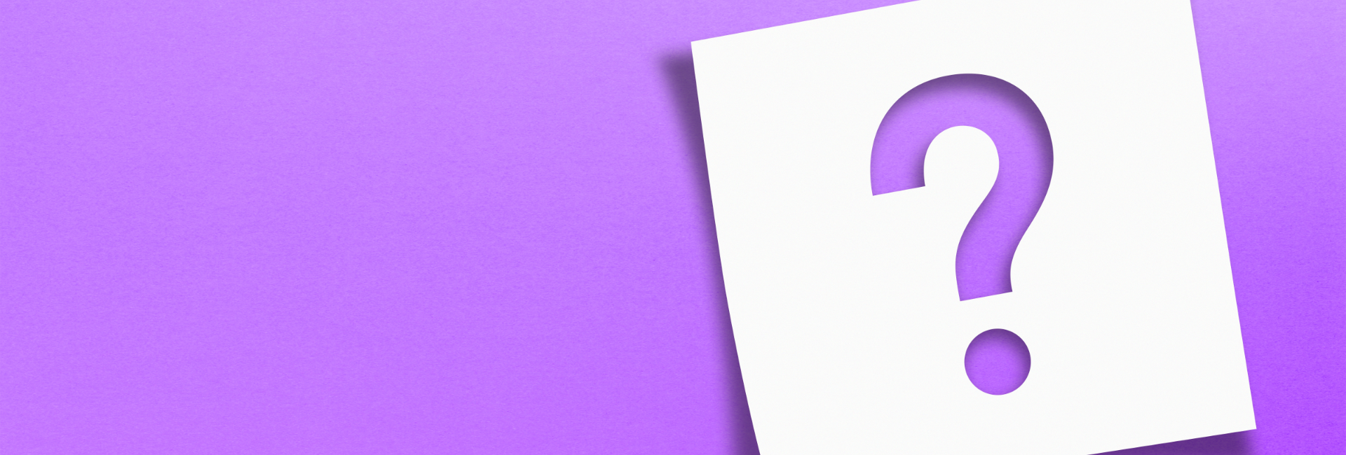 Question Mark Cut Out Of A Sticky Note On Purple 1920X650